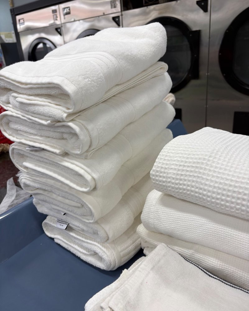 Stacks of freshly washed and folded white towels